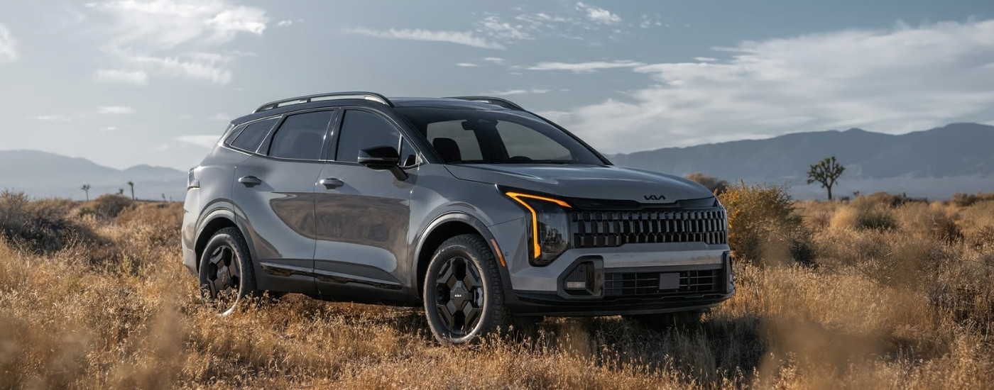 A grey 2026 Kia Sportage from the front at an angle after leaving a dealer that has a Kia Sportage for sale near Katy.