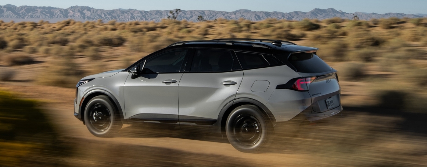 A grey 2026 Kia Sportage from the side.