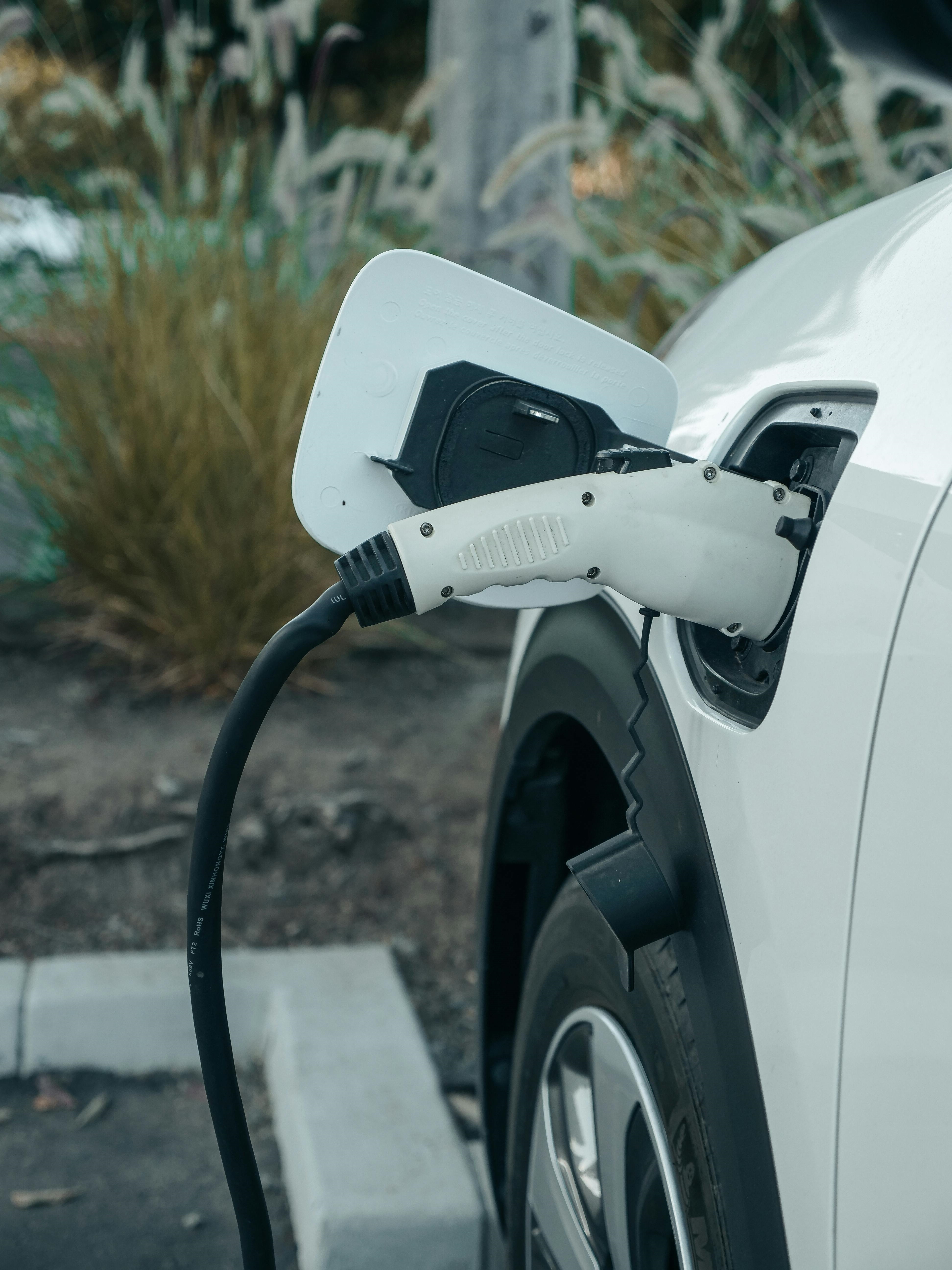 An EV charger plugged into a PHEV