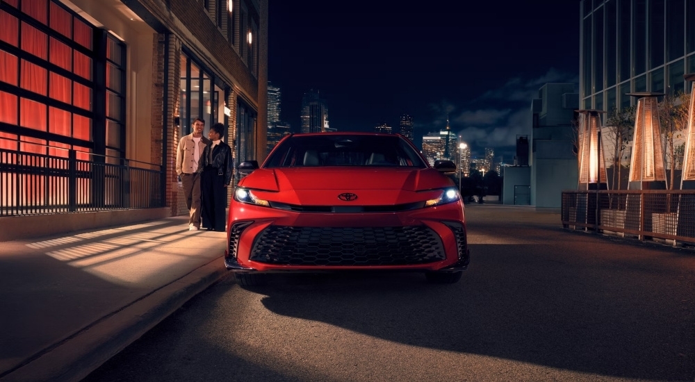 Red 2026 Toyota Camry Nightshade parked on a city street