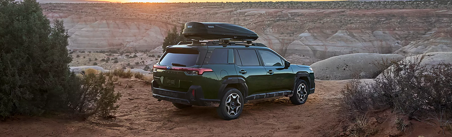 2026 Subaru Outback driving on scenic mountain road