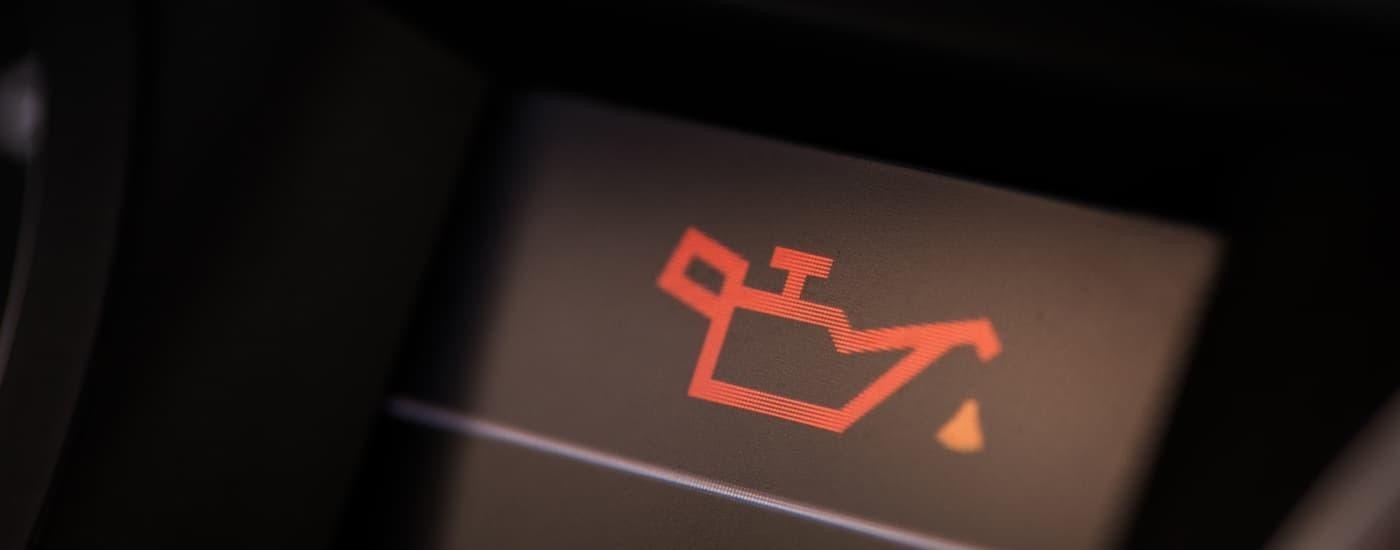 Illuminated check oil light in a vehicle