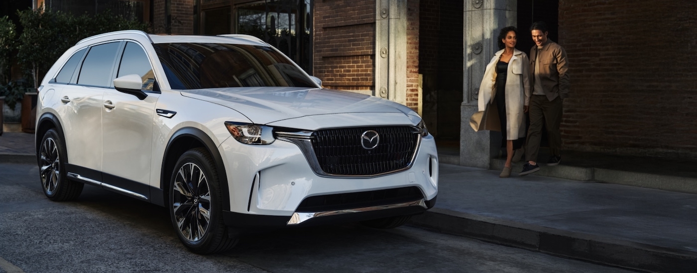 White 2026 Mazda CX-90 Hybrid for sale in Miami parked by a curb.