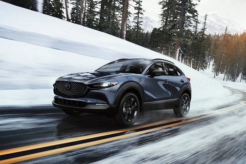 grey 2026 Mazda CX-30 driving down the road