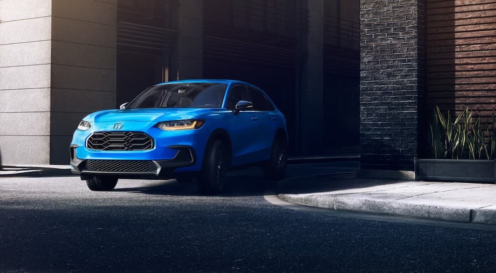 Blue 2026 Honda HR-V driving on a city street