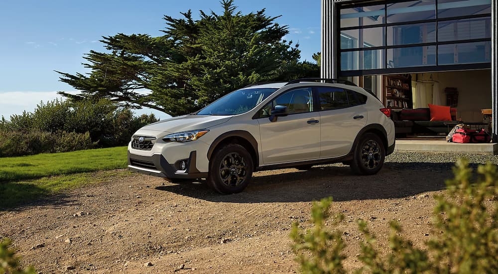 Grey 2023 Subaru Crosstrek parked on a dirt driveway