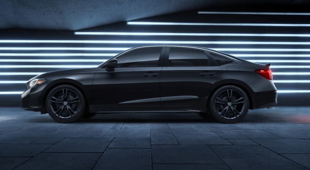 A black 2026 Honda Civic parked in a city.