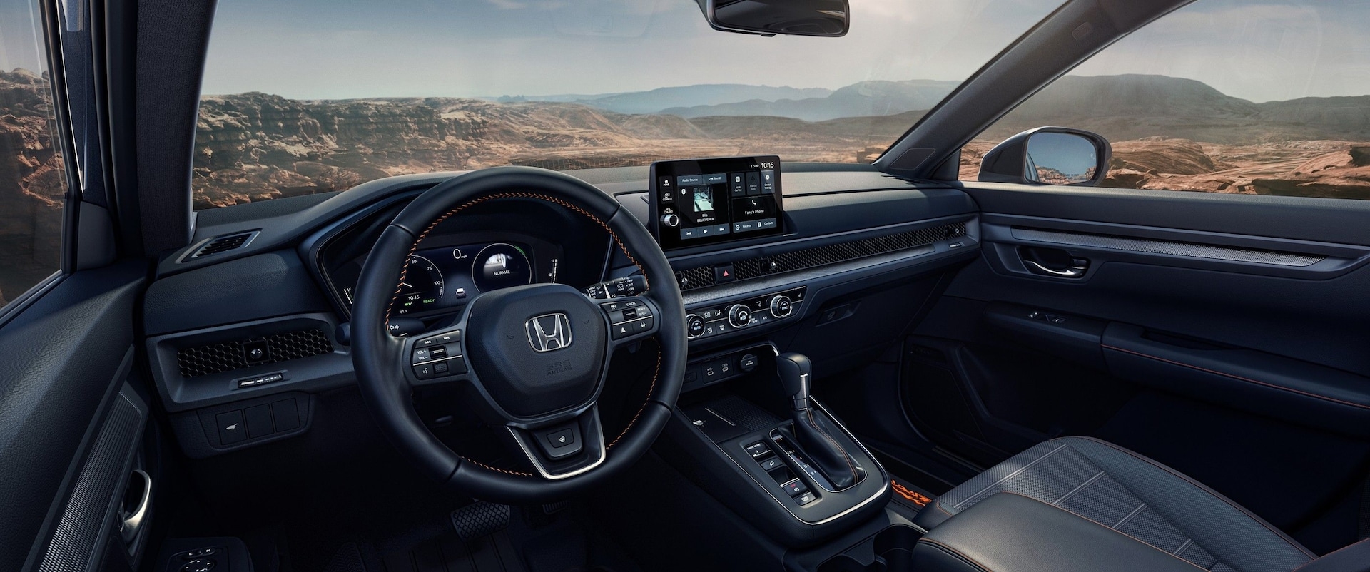 Black wheel and dashboard in the interior of a 2026 Honda CR-V.