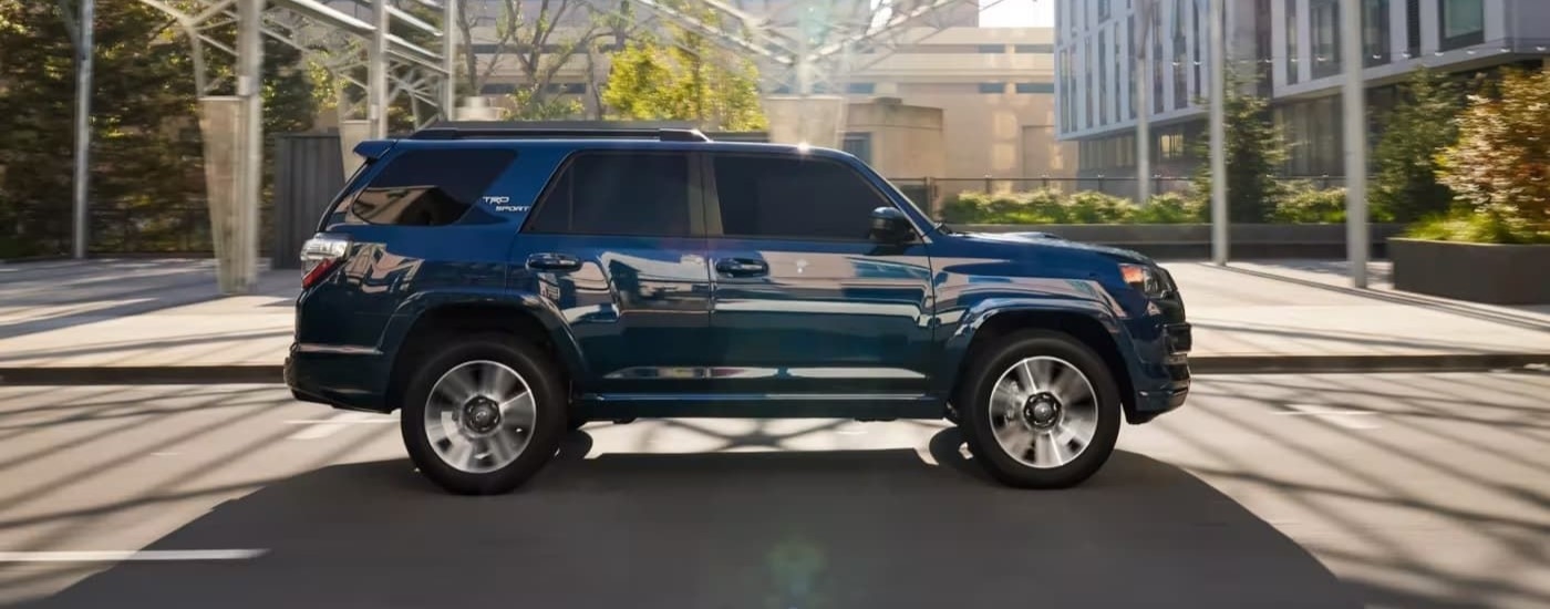 Blue 2023 Toyota 4Runner TRD Sport driving to a used car dealership near Brattleboro