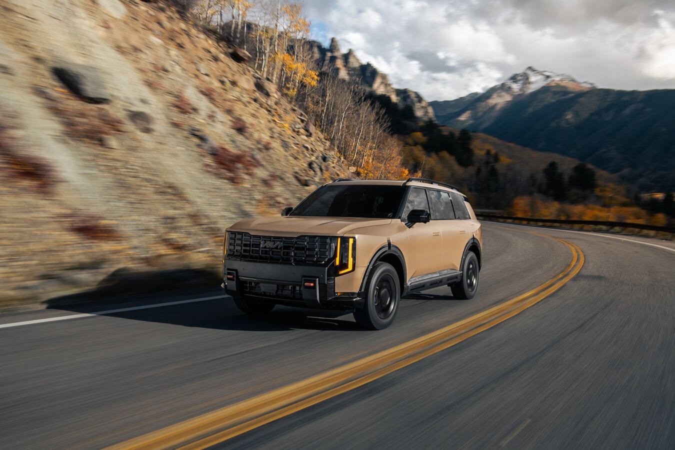 2027 Kia Telluride all-new redesign shown in a Colorado mountain setting highlighting Newsweek Most Anticipated Vehicle recognition and first-ever hybrid powertrain