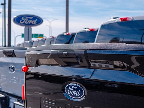 a row of Ford trucks at the Chalmers Ford dealership in Albuquerque, NM