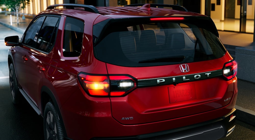 Close-up on the rear of a red 2025 Honda Pilot.