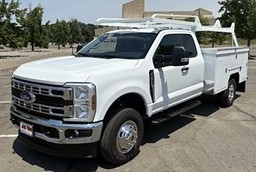 Ford Super Duty towing heavy equipment trailer