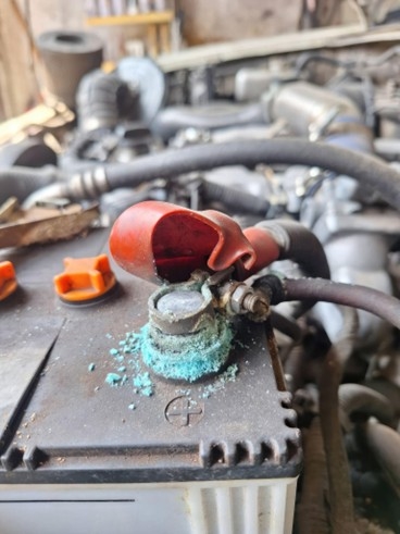 Corrosion buildup on car battery terminals