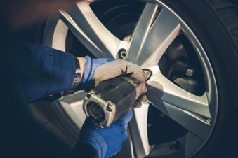 Ford dealership performing tire rotation service