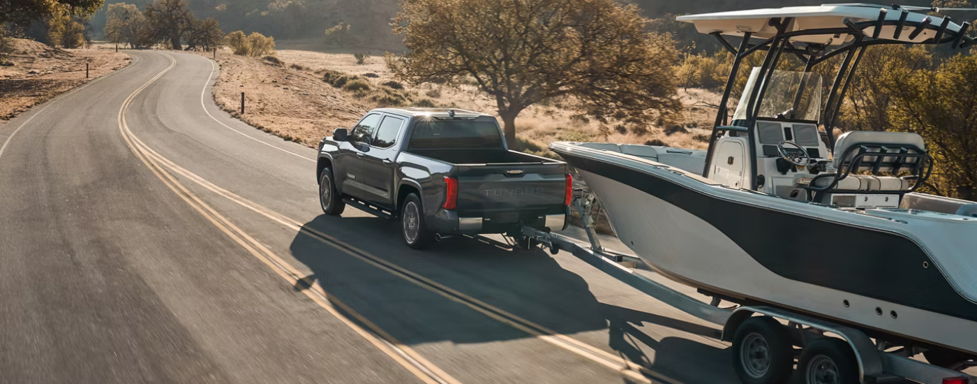 Grey 2026 Toyota Tundra towing a boat