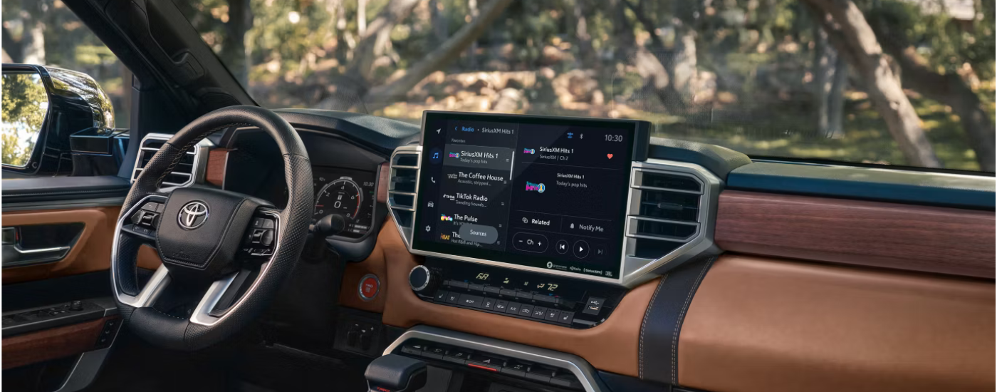 Wood and brown leather interior of a 2026 Toyota Tundra