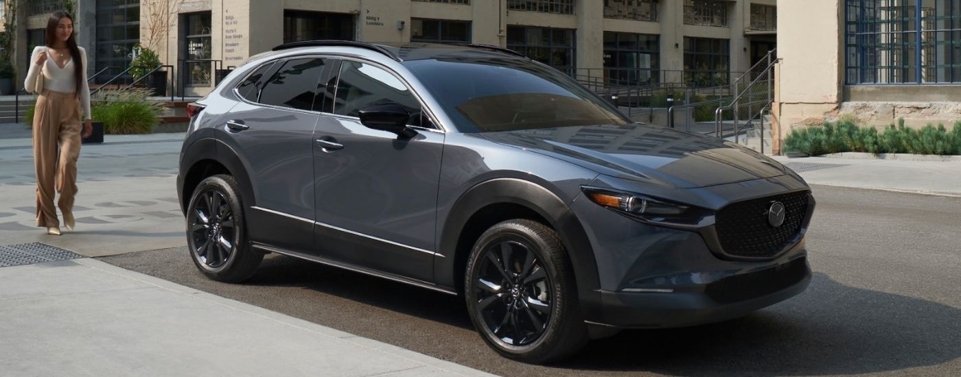 Grey 2026 Mazda CX-30 parked near a building