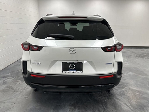 white 2026 Mazda CX-50 Hybrid SUV parked at the Bountiful Mazda dealership in Bountiful, UT