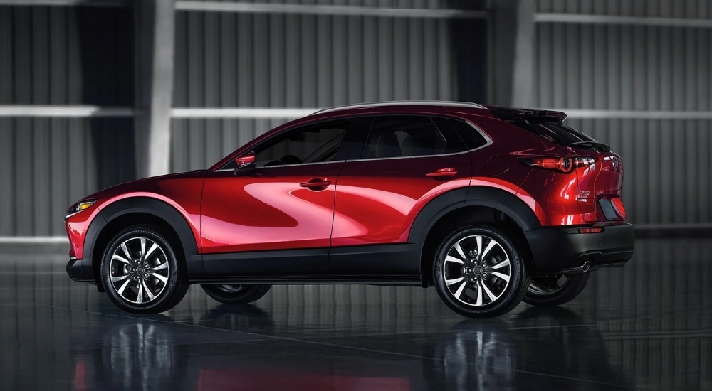 Red 2022 Mazda CX-30 parked in a warehouse