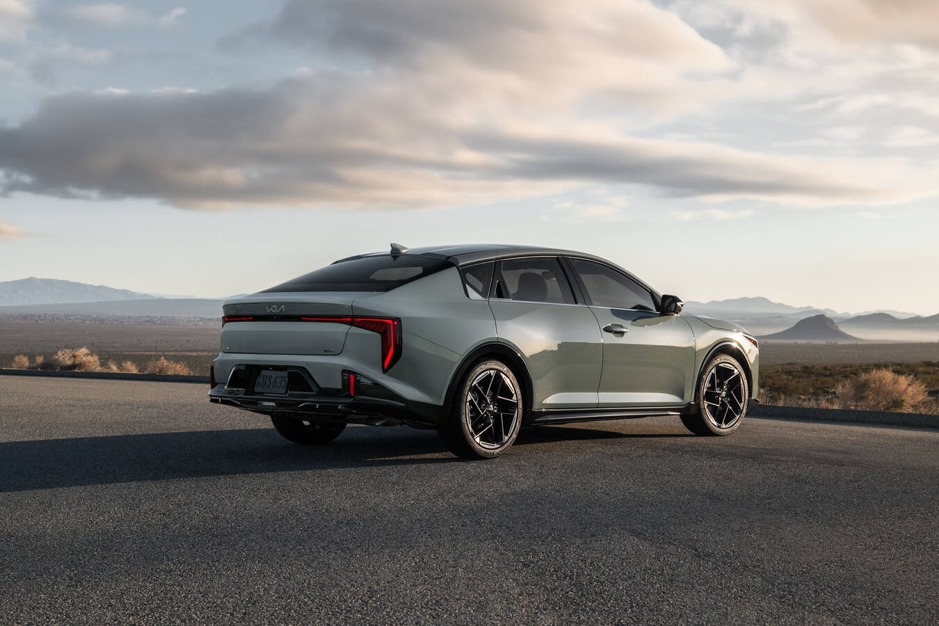 Customer delivery of a new 2026 Kia K4 at a Denver area Kia dealership with service support