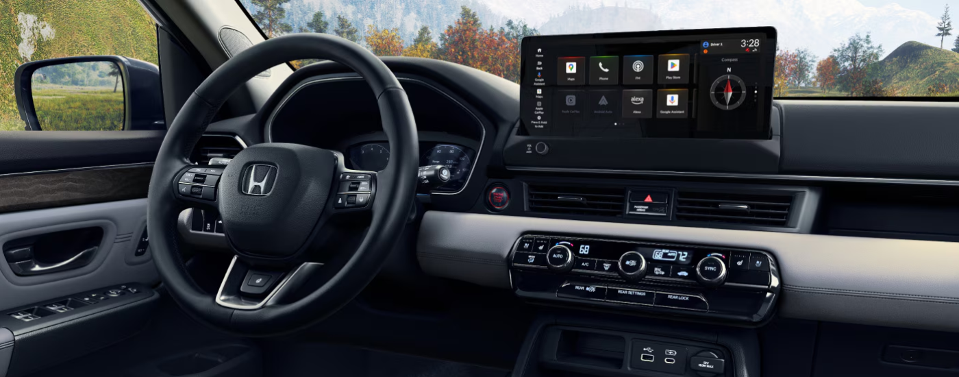 Infotainment display and digital gauge cluster inside a 2026 Honda Pilot