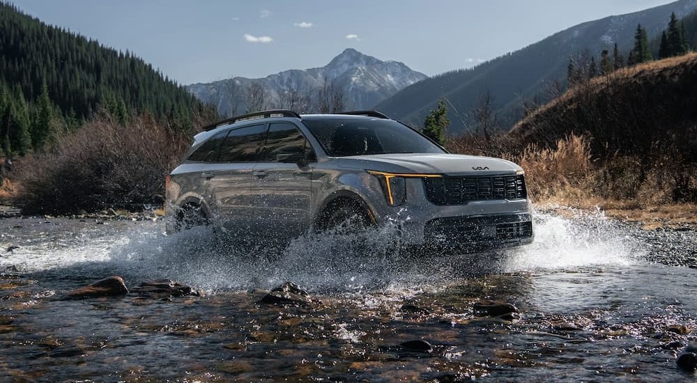 A gray 2026 Kia Sorento X-Pro SX off-roading.