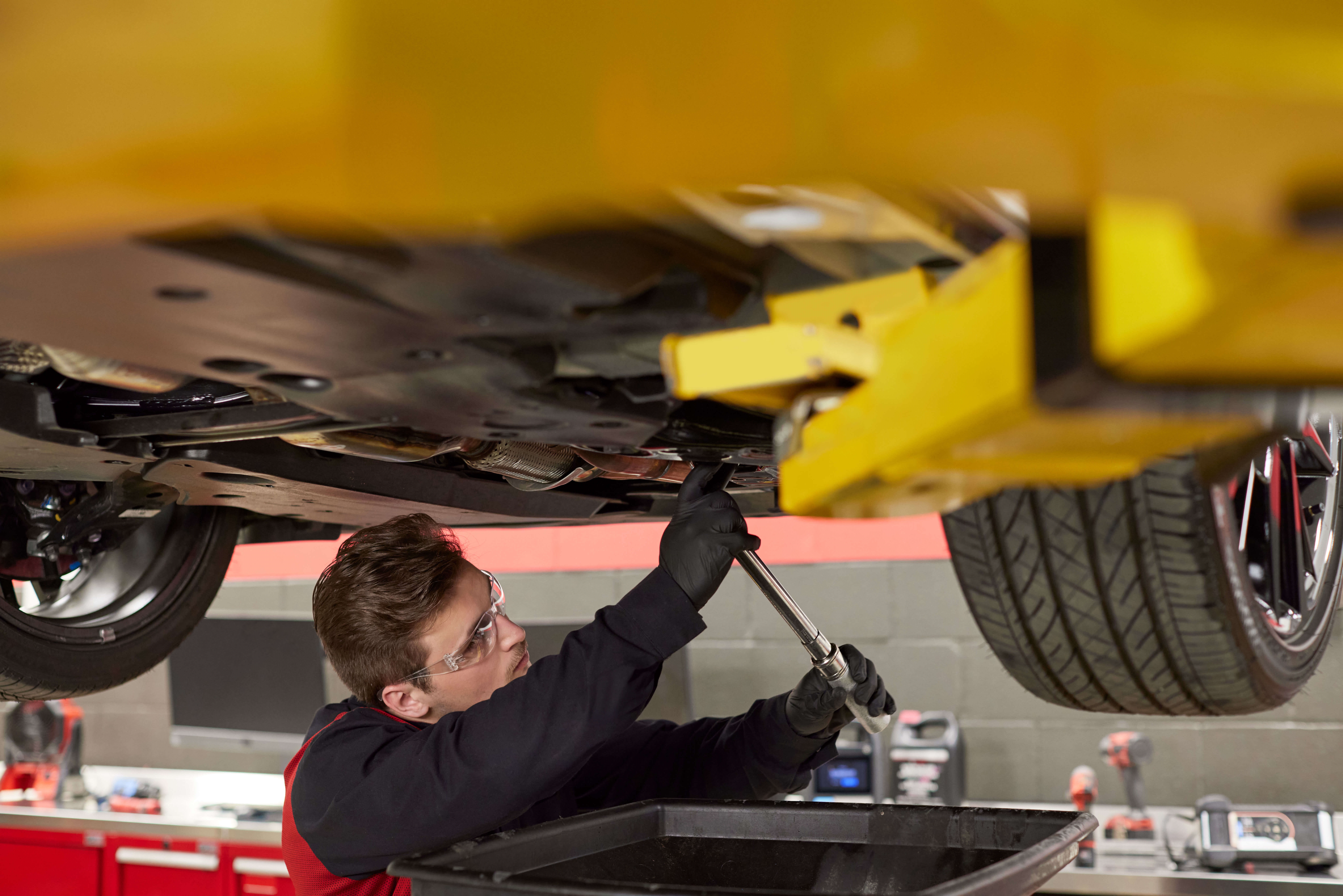 Toyota technician performing vehicle maintenance in Chicago