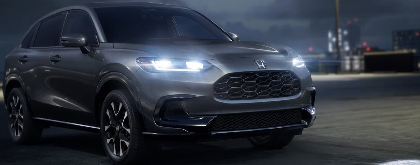 A silver 2026 Honda HR-V parked at night.