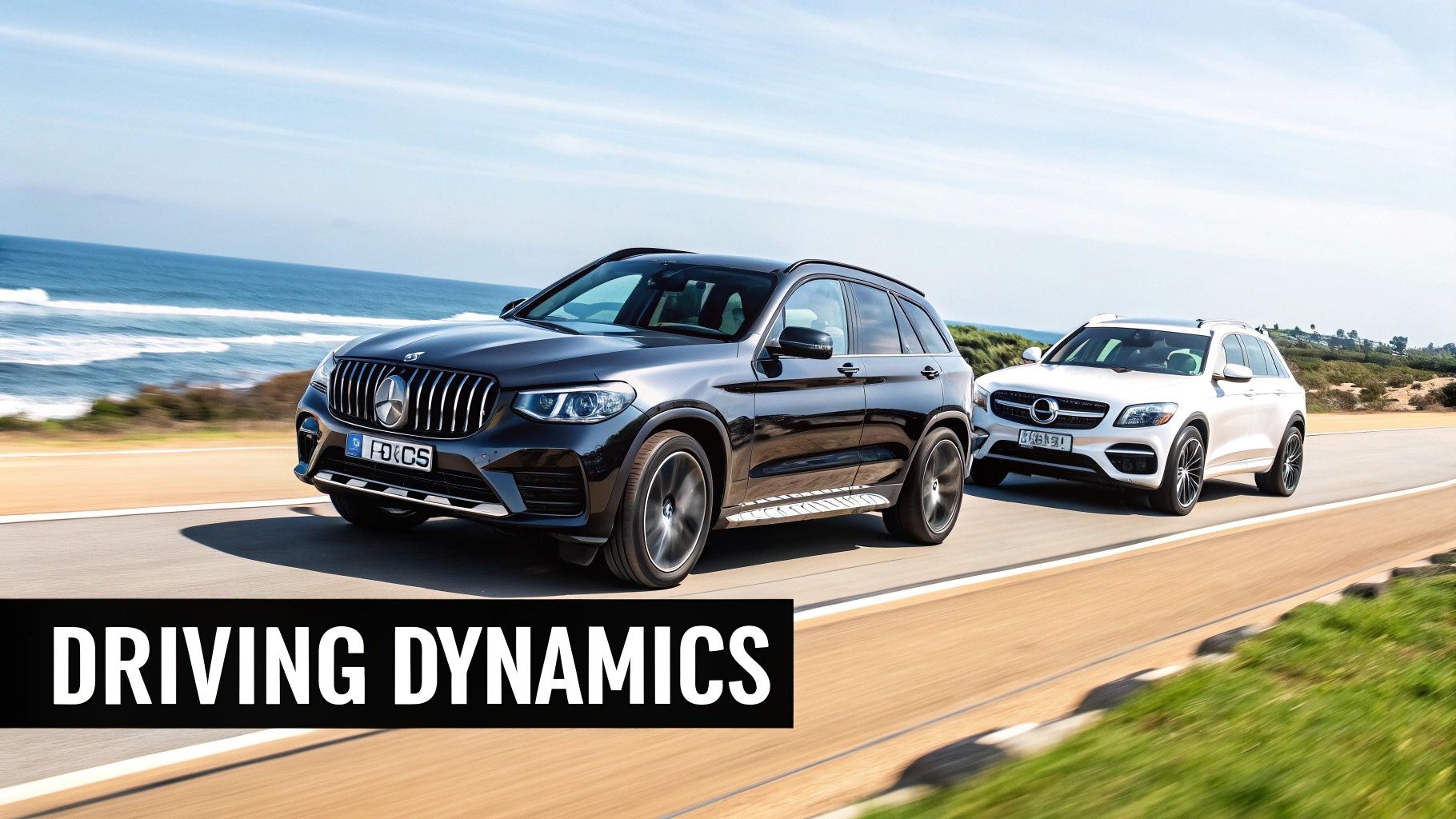 Two Mercedes-Benz SUVs, a black GLC and a white GLC, driving on a coastal road by the ocean.