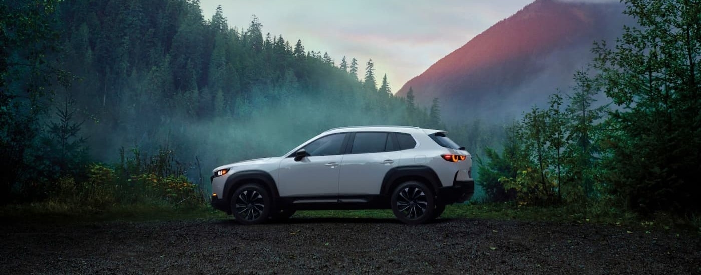 A white 2026 Mazda CX-50 parked in nature.