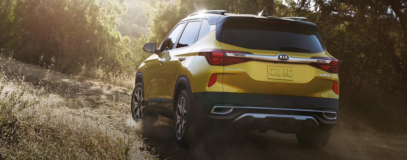 Yellow 2021 Kia Seltos SX driving off-road