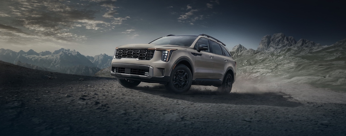 Tan 2024 Kia Sorento parked off-road