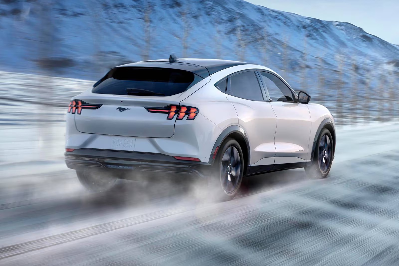 2026 Ford Mustang Mach-E driving in the snow