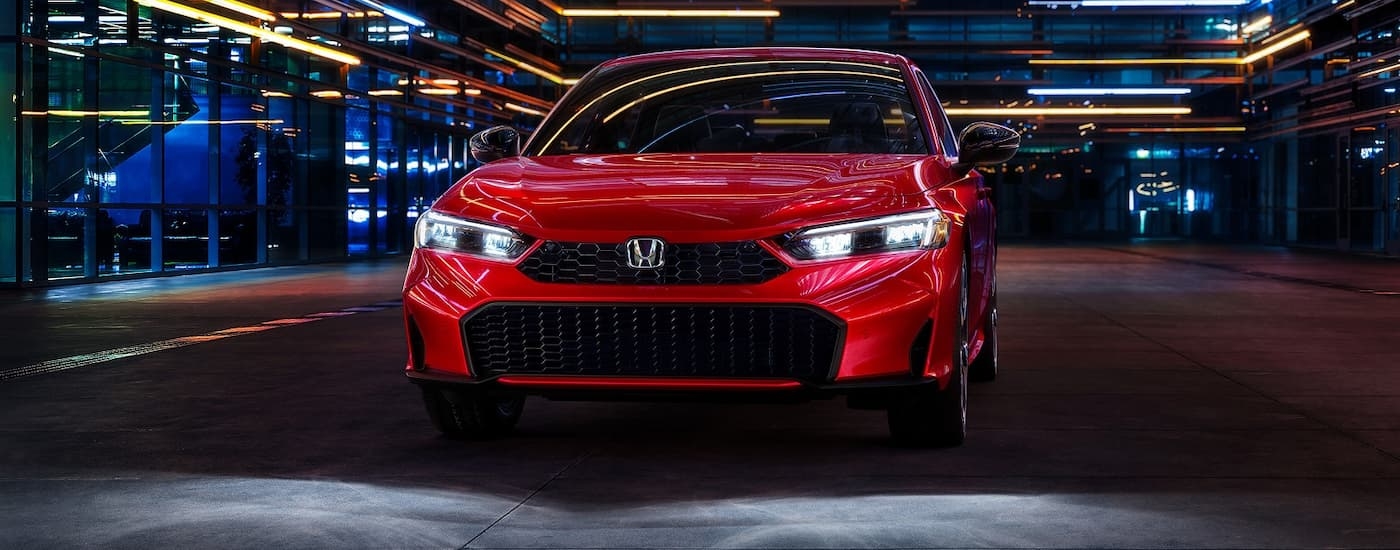 Close-up on the front of a red 2026 Honda Civic.