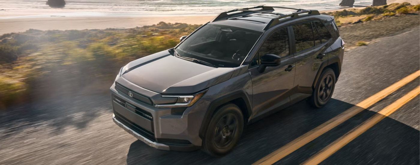 Grey 2026 Toyota RAV4 from above by a beach