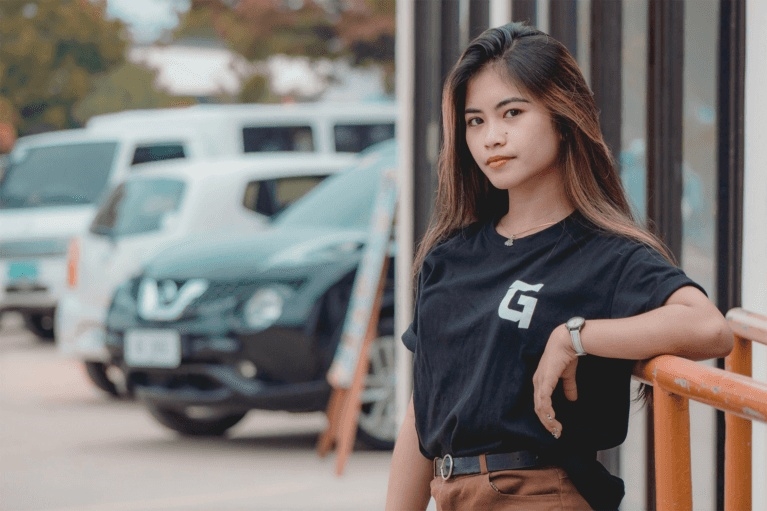 Young woman at a car dealership