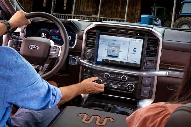 Ford interior driver adjusting the AC