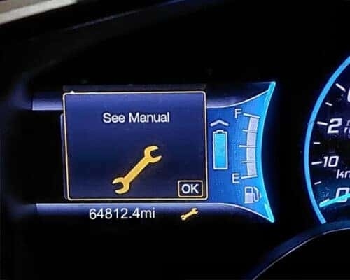 Orange wrench warning light on Ford dash