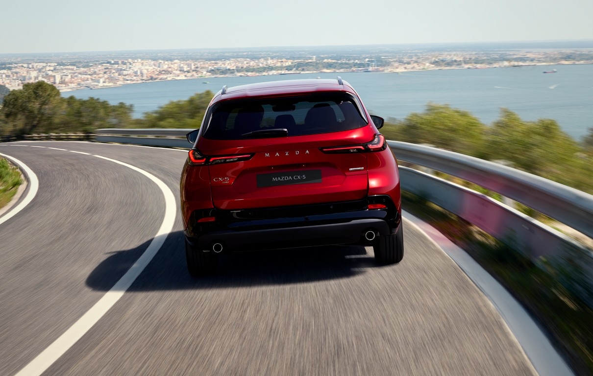 Mazda driving near Miami's coastal roads - heat, humidity, and salt air make scheduled service essential
