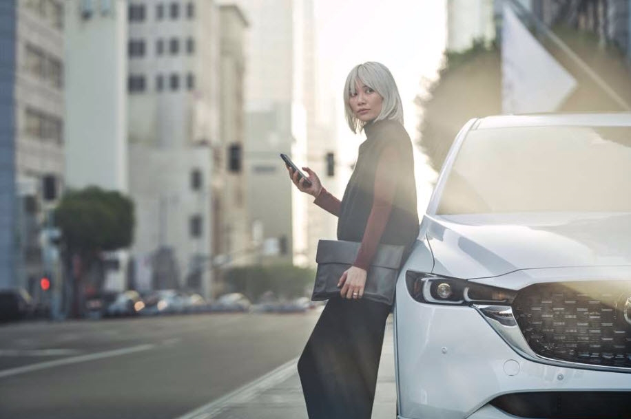 Mazda driving through Miami's coastal roads - pickup and delivery service for Brickell, Coral Gables, and Downtown Miami