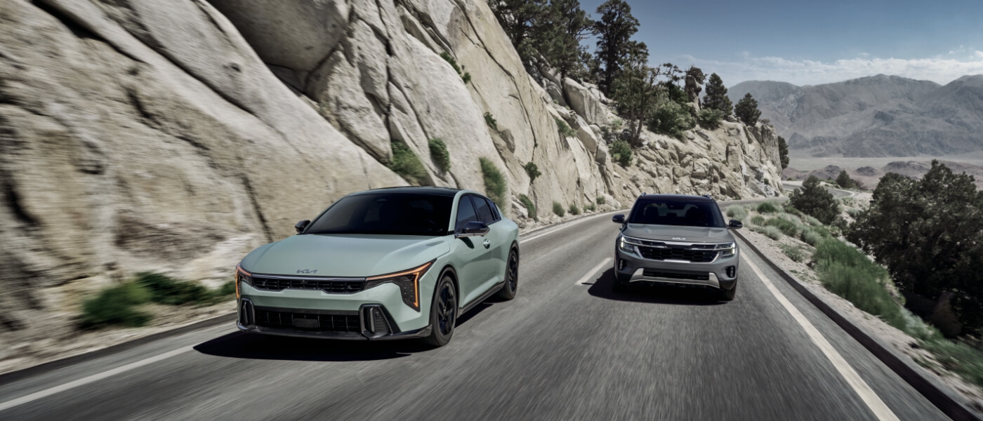 2026 Kia K4 pair driving in mountains