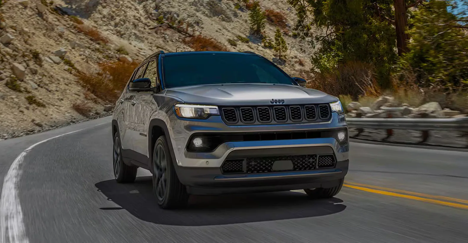 2026 Jeep Compass SUV on rugged terrain