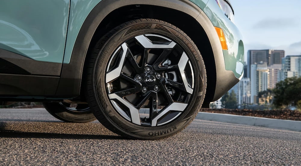 Close-up on the wheel of a blue 2026 Kia Seltos.