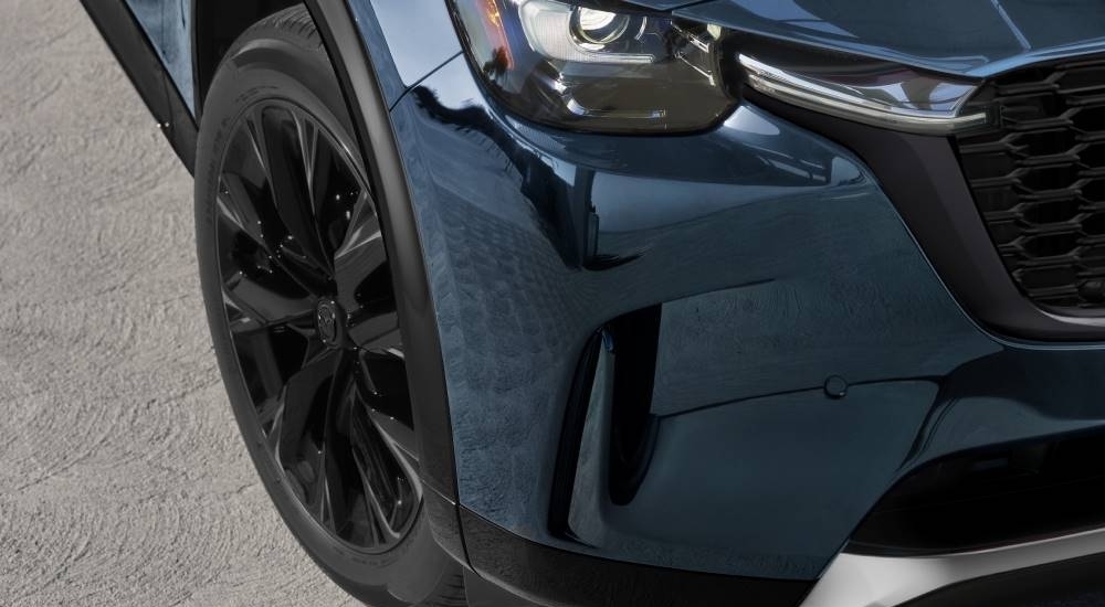 Front bumper on a blue 2026 Mazda CX-90