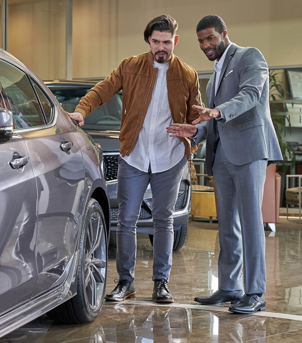 Sales Representative speaking with customer about different vehicle options