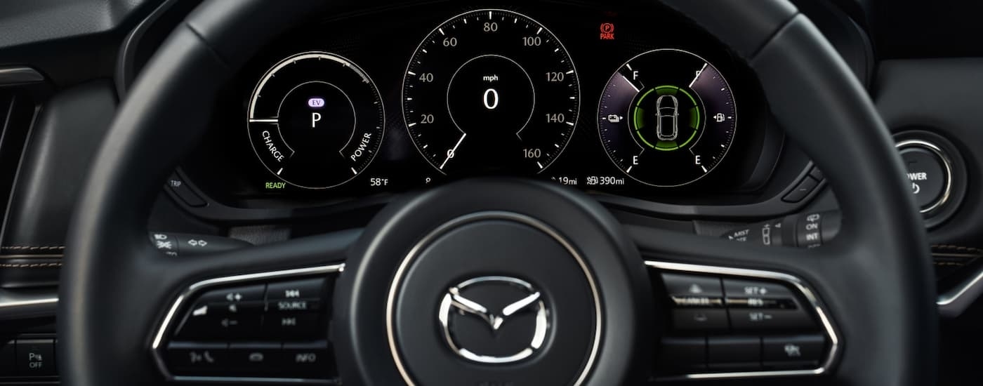 Steering wheel and gauges in a 2026 Mazda CX-90
