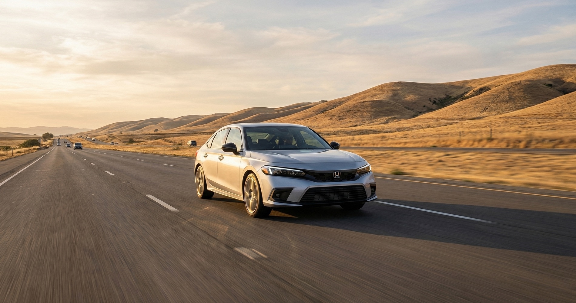 2026 Honda Civic driving on Highway 4 near the Delta region showcasing trim levels