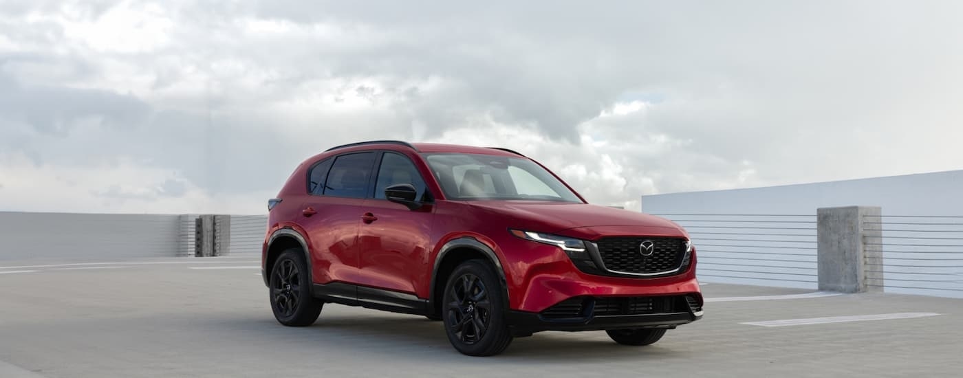 Red 2026 Mazda CX-5 parked on a parking lot.