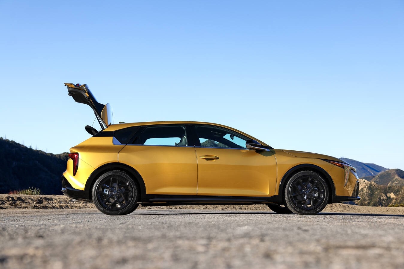 2026 Kia K4 Hatchback exterior front three-quarter view showing floating roofline and LED lighting